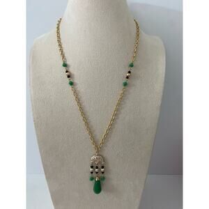 Gold tone and green tribal pendant necklace